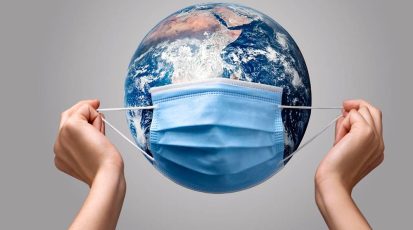 person-putting-medical-mask-earth